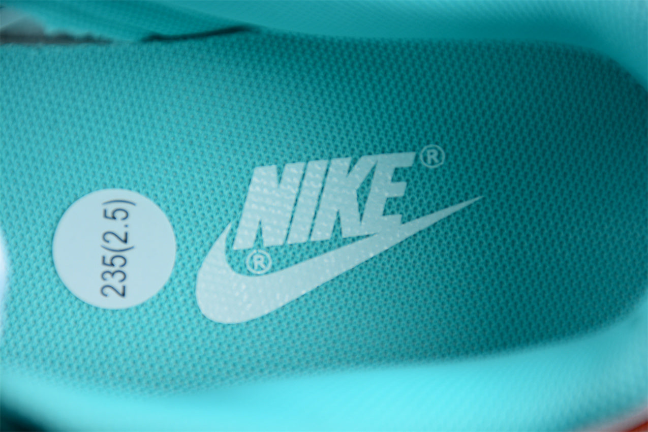 Dunk Low blanco, celeste y naranja