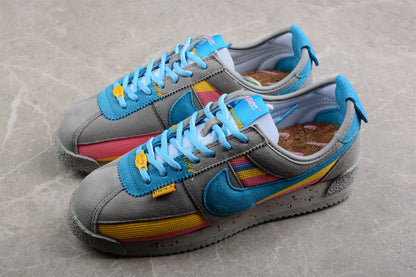 Cortez x Union LA gris, azul, amarillo y rosa