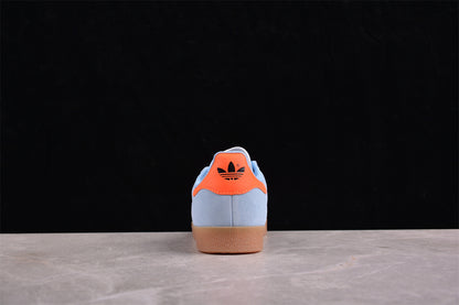 Gazelle azul cielo, negro y naranja