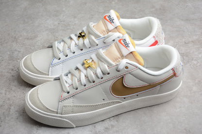 Blazer Low '77 blanco, dorado y rojo