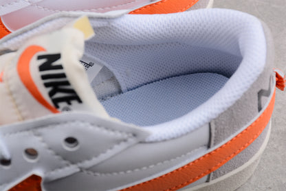 Blazer Low '77 blanco y naranja