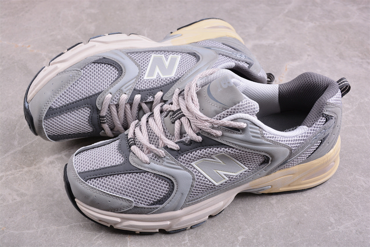 NB 530 gris con suela crema