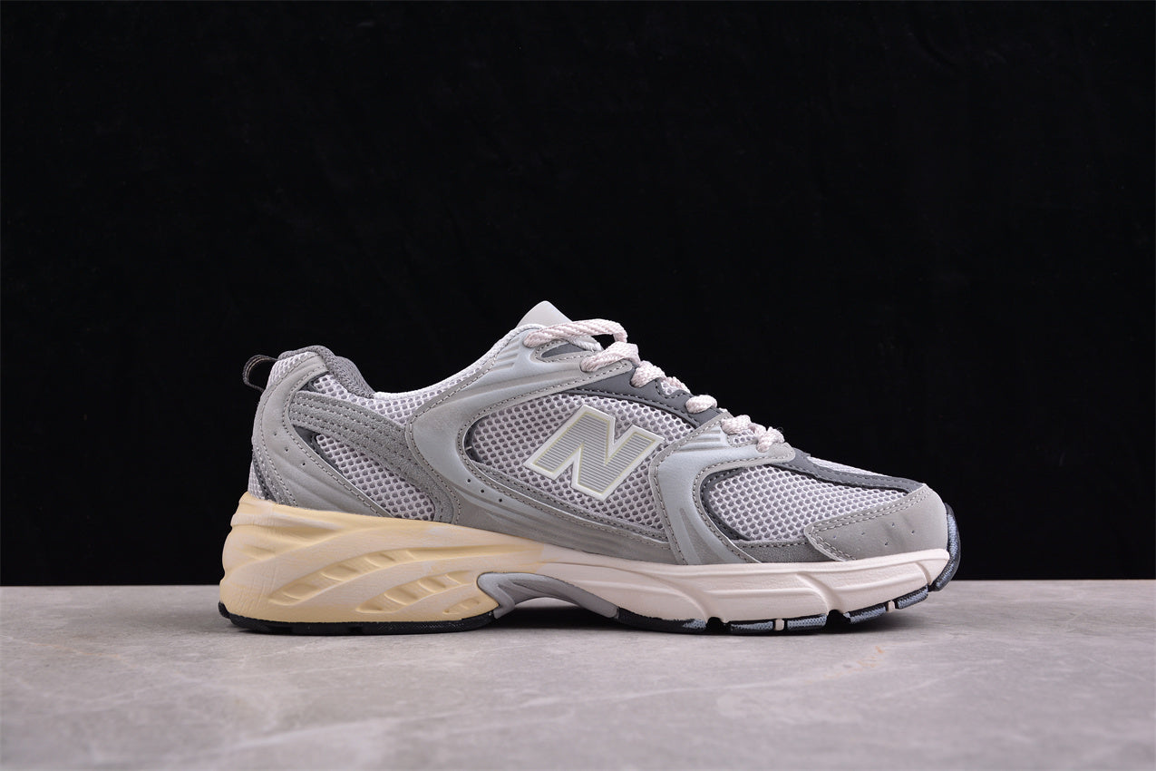 NB 530 gris con suela crema