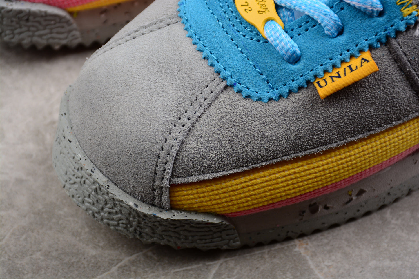 Cortez x Union LA gris, azul, amarillo y rosa