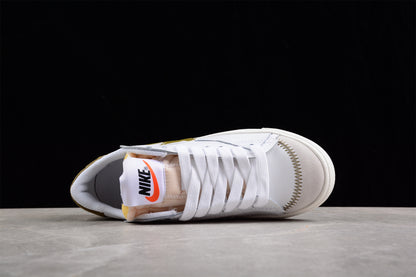 Blazer Low '77 blanco y dorado