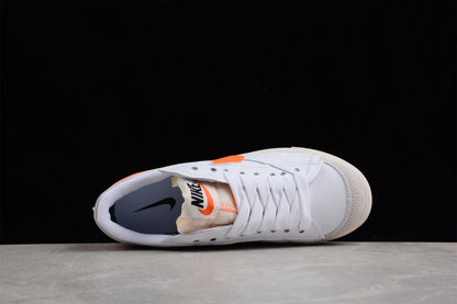 Blazer Low '77 blanco y naranja