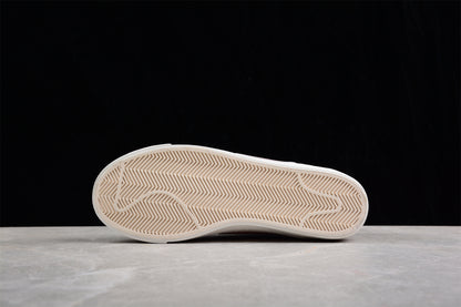 Blazer Low '77 blanco y rosa