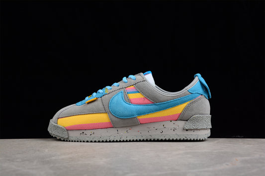 Cortez x Union LA gris, azul, amarillo y rosa